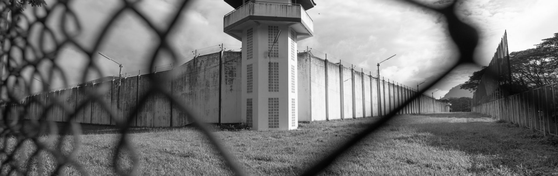 Prison,Watchtower,Protected,By,Wire,Of,Prison,Fence.white,Prison,Wall